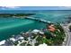 A captivating aerial view of homes along the water with a bridge in the distance at 1435 Westway Dr, Sarasota, FL 34236