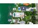 Aerial view of luxurious homes, featuring private docks, swimming pools, and lush tropical landscaping at 1435 Westway Dr, Sarasota, FL 34236