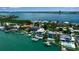 Magnificent waterfront estates with private docks line the beautiful turquoise coastline in this aerial view at 1435 Westway Dr, Sarasota, FL 34236