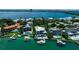 Luxury waterfront homes are showcased with beautiful swimming pools and private boat docks at 1435 Westway Dr, Sarasota, FL 34236