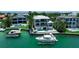 Beautiful waterfront home with a boat lift, dock, and pool for enjoying waterfront living at 1435 Westway Dr, Sarasota, FL 34236