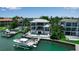 Waterfront property featuring a private dock, boat lift, and sparkling pool, perfect for outdoor recreation at 1435 Westway Dr, Sarasota, FL 34236