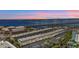 Stunning dusk aerial view captures waterfront condos and the scenic bridge at 150 Harborside Ave # 221, Punta Gorda, FL 33950