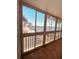 The enclosed balcony showcases waterfront views including palm trees and a bridge at 150 Harborside Ave # 221, Punta Gorda, FL 33950