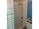 Bathroom with tub/shower combo and white tile surround at 150 Harborside Ave # 221, Punta Gorda, FL 33950