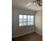 A bedroom featuring a bridge view through a window and wood flooring at 150 Harborside Ave # 221, Punta Gorda, FL 33950