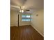 Cozy bedroom with wood-look flooring and a ceiling fan at 150 Harborside Ave # 221, Punta Gorda, FL 33950