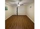 Bright bedroom with wood-look flooring and a ceiling fan at 150 Harborside Ave # 221, Punta Gorda, FL 33950