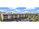 Condo building's exterior displays its architectural style and parking facilities at 150 Harborside Ave # 221, Punta Gorda, FL 33950