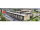 Condo exterior featuring architectural details, landscaping, and parking spots at 150 Harborside Ave # 221, Punta Gorda, FL 33950
