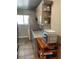 A kitchen featuring granite countertops, custom cabinets, a sink, and a stainless steel microwave at 150 Harborside Ave # 221, Punta Gorda, FL 33950
