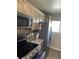 Well-equipped kitchen with stainless steel appliances, granite countertops, and tile backsplash at 150 Harborside Ave # 221, Punta Gorda, FL 33950