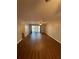 Bright living room with wood floors, light colored walls, and sliding glass doors at 150 Harborside Ave # 221, Punta Gorda, FL 33950