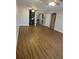 Spacious living room features updated floors, modern ceiling fan and a glimpse of the kitchen and additional rooms at 150 Harborside Ave # 221, Punta Gorda, FL 33950