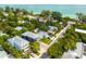 Stunning aerial view of the neighborhood homes with views of the Gulf of Mexico at 159 Crescent Dr, Anna Maria, FL 34216