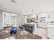 Modern kitchen with island, white cabinets, and stainless steel appliances at 159 Crescent Dr, Anna Maria, FL 34216