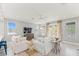 Bright living room with neutral tones and access to outdoor balcony at 159 Crescent Dr, Anna Maria, FL 34216