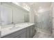 Spacious bathroom features double sinks, marble floors and a walk in glass shower at 160 Eagleston Ln, Lakewood Ranch, FL 34240