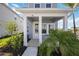 Charming front porch adorned with lush greenery, creating a welcoming entrance to this lovely home at 160 Eagleston Ln, Lakewood Ranch, FL 34240