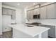 Modern kitchen featuring stainless steel appliances, quartz countertops and stylish gray cabinets at 160 Eagleston Ln, Lakewood Ranch, FL 34240