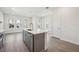 Spacious kitchen area featuring an island and stainless steel appliances with great natural lighting at 160 Eagleston Ln, Lakewood Ranch, FL 34240