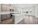 Modern kitchen featuring stainless steel appliances, light gray cabinetry, and a large center island at 160 Eagleston Ln, Lakewood Ranch, FL 34240