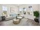 Bright living room with stylish furniture, neutral tones, and lots of natural light at 160 Eagleston Ln, Lakewood Ranch, FL 34240