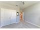 Clean bedroom featuring double closets and neutral carpet at 17555 Cantarina Cv, Bradenton, FL 34211