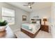 Cozy bedroom featuring a ceiling fan, carpeted floors, and a modern design at 17555 Cantarina Cv, Bradenton, FL 34211