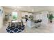 Open kitchen features stainless appliances, granite countertops, and a central island with bar seating and adjacent dining area at 17555 Cantarina Cv, Bradenton, FL 34211