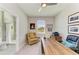 Bright office featuring a ceiling fan, multiple photos, and a large desk at 17555 Cantarina Cv, Bradenton, FL 34211