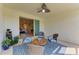 Cozy screened patio with elegant water feature and seamless indoor/outdoor flow to the living room at 17555 Cantarina Cv, Bradenton, FL 34211