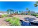 Community playground featuring slides and climbing equipment on a sunny day at 17555 Cantarina Cv, Bradenton, FL 34211