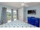 Bright bedroom with balcony access and a view, coastal-themed decor and a TV at 205 17Th N St, Bradenton Beach, FL 34217