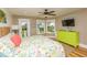 Bright bedroom with a view to the sea, ceiling fan, and coastal-themed decor at 205 17Th N St, Bradenton Beach, FL 34217