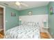 Charming bedroom with hardwood floors, stylish lamps, and a comfortable queen-sized bed at 205 17Th N St, Bradenton Beach, FL 34217