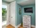 Cozy bedroom featuring a balcony, white chest with drawers, and a TV at 205 17Th N St, Bradenton Beach, FL 34217