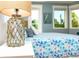 Comfortable bedroom with patterned bedding, coastal decor, and hardwood flooring at 205 17Th N St, Bradenton Beach, FL 34217