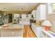 Spacious kitchen with granite counters, white cabinets, and stainless steel appliances with lots of natural light at 205 17Th N St, Bradenton Beach, FL 34217