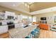 Bright kitchen and living room featuring an island with granite countertops and stainless steel appliances at 205 17Th N St, Bradenton Beach, FL 34217