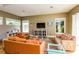 Bright living room with hardwood floors, comfortable seating, and large windows offering plenty of natural light at 205 17Th N St, Bradenton Beach, FL 34217