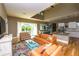 Open concept living room with vaulted ceiling blends seamlessly into dining and kitchen areas at 205 17Th N St, Bradenton Beach, FL 34217