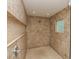 Tiled shower stall with a built-in shelf and a small window for natural light at 205 17Th N St, Bradenton Beach, FL 34217