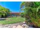 The lush backyard offers a serene outdoor space with plenty of greenery and privacy at 2121 Pueblo Cir # V6, Sarasota, FL 34231