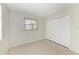 Bedroom with a closet, window and tiled floor at 2121 Pueblo Cir # V6, Sarasota, FL 34231