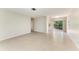 Spacious living room with tile flooring and sliding glass doors with ample natural light, perfect for relaxing at 2121 Pueblo Cir # V6, Sarasota, FL 34231