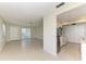 Open living space with tile flooring, stainless steel appliances, and a view into the kitchen at 2121 Pueblo Cir # V6, Sarasota, FL 34231