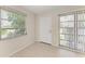 Light filled sun room with tile floors, sliding glass doors, and a large window with great views at 2121 Pueblo Cir # V6, Sarasota, FL 34231