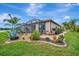 Backyard featuring a well manicured patio with manicured landscaping at 213 Babbling Brook Run, Bradenton, FL 34212