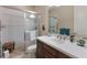 Bright bathroom features a walk-in shower, single vanity, and a toilet, creating a functional space at 2397 Vaccaro Dr, Sarasota, FL 34231